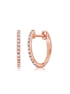 The classic diamond huggie gets a dainty delicate detail that breaks up the serenity of its sparkling stones. Crafted in 14K yellow, white or rose gold with .06ctw of round pave diamonds, these mini hoops offer a subtle sparkle and essential style. The design is so versatile you’ll want to reach for them every day. Available as a pair or a single. Classic Rose Gold Diamond Hoop Earrings, Classic Rose Gold Diamond Huggie Earrings, Classic Rose Gold Huggie Earrings With Single Cut Diamonds, Rose Gold Prong Setting Huggie Earrings, Classic Rose Gold Huggie Earrings With Brilliant Cut, Rose Gold Huggie Hoop Earrings Vvs Clarity, Formal Rose Gold Huggie Earrings With Diamond Accents, Formal Rose Gold Huggie Diamond Earrings, Classic Rose Gold Huggie Diamond Earrings