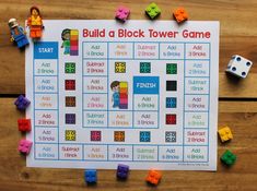 a game board with legos and building blocks on the table next to it is called build a block tower game