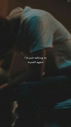 a blurry image of a person laying on a bed with the words i'm just talking to myself again