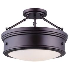 a semi flush ceiling light with an oval glass shade