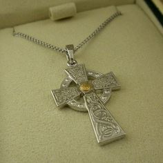 "Sterling Silver Celtic Warrior Shield Cross with 18K Yellow Gold Plate Shield Accent 1.5\" long with bale .75\" wide Adjustable 18\" to 20\" Sterling Silver Chain Hallmarked .925 Beautifully boxed with an explanation card Nicely boxed. Hallmarked and handcrafted in Ireland. In Stock! Ships Immediately. Ships Free within the USA 21 Day Returns Items must be returned in new unworn condition." Warrior Shield, Celtic Warrior, Celtic Warriors, Cross Pendant, Sterling Silver Chains, Silver Chain, Arrow Necklace, 18k Gold, Gold Plate