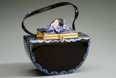 This artistic bag is based on the story of sleeping beauty. A sculpture head sits on top of a this two tier bag surrounded by antique glass flowers beads.  Detailed stippled painting adds to the true art of this unique bag. I began making this bag the same way I approach one of my art pieces. Much of my art work has been inspired by fairytales. Why can't a handbag be an art piece? Why can't we take our art out with us? What fun! Elegant Hand Painted Rectangular Bag, Elegant Hand Painted Rectangular Bags, Artistic Rectangular Evening Bag, Fashion Objects, Accessories Matching, Fairytale Style, Artist Bag, Flowers Beads, Sculpture Head