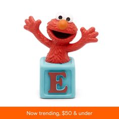 the sesame character is posed on top of an e cube