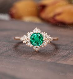 "MADE TO ORDER * Material: Solid gold(14K/18K white/yellow/rose gold) * DETAILS  57524 ✨Engagement ring - Center stone: Lab Emerald 6mm Round cut Side stones: Moissanite or Diamond - moissanite:0.13ct - diamond:0.13ct,Color G-H,Clarity SI-VS * Click on the \"Pin It\" icon if you like this item * Custom Order We can make custom rings in almost any shape and style. If you want a specific model, please send us a clear picture and we will do our best.  * Shipping Most items take 3-4 weeks to create.I'm happy to rush your order, fees may apply, write me for details. * Payment Plans I offer payment plans. The minimum per payment will be $100. Write me your finger size, metal color, How much you would like to pay for the first payment. I will create a payment plan which will be customized special Rose Gold Emerald Ring, Antique Promise Rings, Vintage Emerald Engagement Ring, Round Diamond Halo, Engagement Ring Emerald, Gold Leaf Rings, Emerald Wedding Rings, Deco Rose, Floral Halo