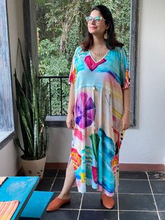 "This is our \"Timeless\" style kaftan. It features a drawstring that you can cinch at the waist. This loose fitting Caftan House dress is exceptionally comfortable and stylish. I created a short video about this style https://youtu.be/GDo-9c5XItk As for the fabric pattern, we have used a hand drawn and digitally painted technique. So they are all unique designs. It is like wearing wearable art. What I love about digital paintings is that they look as beautiful as the hand paintings but the care Casual Tunic Kaftan For Daywear, Casual Flowy Kaftan With Short Sleeves, Casual Short Sleeve Flowy Kaftan, Casual Flowy Short Sleeve Kaftan, Multicolor Tunic Kaftan For Loungewear, Printed Multicolor Dresses For Loungewear, Casual Multicolor Maxi Dress For Loungewear, Multicolor Relaxed Fit Dress For Vacation, Multicolor Drawstring Dress For Vacation