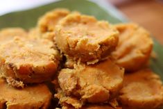 some fried food is on a green plate