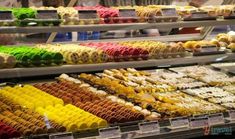 an assortment of desserts on display in a store