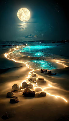 some rocks and lights on the sand by the water with a full moon in the background