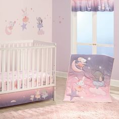 a baby's room decorated in pink and purple