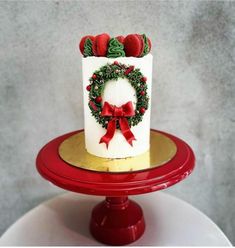 a decorated christmas cake sitting on top of a red plate