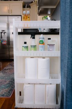 a shelf filled with lots of toilet paper