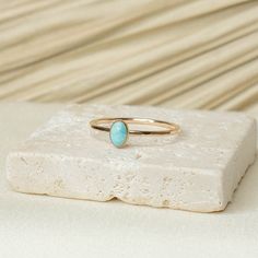 Turquoise Stone has often been associated with protection, luck, and abundance. In many cultures , it is believed that wearing turquoise can ward off negative energies and bring good fortune. Details: 14K Gold Filled + Sterling Silver 6x4mm Turquoise 1.3MM Textured Ring Since every piece is handmade, you may experience a slight color difference in places where the metal has been soldered making every piece truly unique. Purchase three or more rings and save 20% with discount code 'STACK20' Handmade Classic Oval Turquoise Ring, Oval Turquoise Rings With Natural Stones, Oval Turquoise Birthstone Ring, Oval Turquoise Birthstone Ring As Gift, Oval Turquoise Birthstone Ring For Gift, Turquoise Opal Ring In 14k Gold As Gift, Oval Stackable Turquoise Ring Gift, Oval Turquoise Stackable Ring As Gift, Oval Stackable Turquoise Ring As Gift