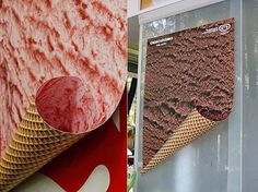 an ice cream cone is on display in front of a wall with red and white designs