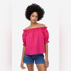 Slightly Shorter, Off-The-Shoulder Top In A Soft Cotton Weave With Short Sleeves. Loose Fit With Narrow Elastication And A Small Frill Trim At The Top And Cuffs. Pink Off-shoulder Top For Summer Day Out, Cotton Cold Shoulder Tops, Feminine Off-shoulder Top For Summer Day Out, Pink Off-shoulder Top For Summer, Feminine Off-shoulder Top For Day Out In Summer, Feminine Pink Off-shoulder Top For Summer, Summer Cold Shoulder Off-shoulder Top, Spring Cotton Off-shoulder Top, Trendy Cold Shoulder Off-shoulder Top For Summer