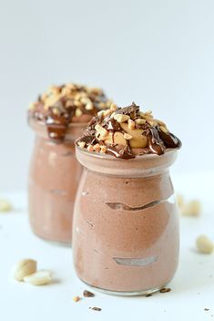 two small jars filled with chocolate and nuts