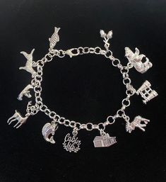 New. This Bracelet makes a perfect gift. Has  11 Cabin Life Themed Charms all charms are approx 1/2" to 1" in size Stainless Steel bracelet has a lobster clasp closure and is adjustable measures approx 8" bracelet is Stainless Steel  charms are silver tone alloy and steel. (Nickel and lead free) Charms include small fish, dog, person on canoe, deer, trout fish, cabin life charm, log cabin, moose, binoculars, Bear, acorns Adjustable Novelty Charm Bracelet, Adjustable Themed Charms Jewelry, Novelty Charms Bracelet Jewelry, Novelty Jewelry Charms Bracelet, Adjustable Themed Jewelry With Dangling Charms, Themed Adjustable Jewelry With Dangling Charms, Adjustable Novelty Charm Bracelet With Lobster Clasp, Adjustable Sterling Silver Charm Bracelet With Lobster Clasp, Silver Novelty Charm Bracelet With Lobster Clasp