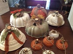 several decorative pumpkins are sitting on the table