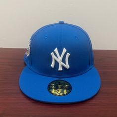 Brand - New Era Hat Model - 59fifty Hat Type - Fitted Team - New York Yankees League - Mlb Condition - Brand New Color - Blue & White Sizes Available; 7 1/8 Blue Fitted Hat With Embroidered Logo For Streetwear, Blue Embroidered Snapback Fitted Hat, Blue Flat Cap For Baseball Season, Blue Baseball Cap With Flat Brim For Fan Gear, Blue Baseball Cap With Embroidered Logo, Blue Fitted Hat For Baseball Season, Blue Flat Cap For Sports, Blue Flat Brim Baseball Cap For Fan Gear, Blue Fitted Hat With Embroidered Logo And Curved Brim