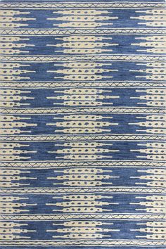 a blue and white rug with lines on it