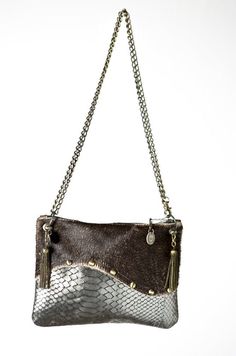 "Our handmade leather silver and brown wavy crossbody handbag is 100% leather.  It is a small size bag and has a long adjustable metal chain. It is possible to wear it longer or shorter and it will be your best friend for nights out or everyday wear. It's a small size, elegant and practical.  Color Front : Brown & Silver Color Back : Brown Detail :     100% Cow and Lamb Leather     Zip 20cm/7.8\"      H: 17cm/6.6\" W: 22cm/8.6\"      Adjustable Metal Chain: 130cm/51     Old Coins from Burma" Silver Leather Clutch Shoulder Bag, Brown Leather Clutch With Chain Strap, Silver Crossbody Clutch For Daily Use, Silver Leather Shoulder Bag As Gift, Silver Leather Shoulder Bag For Gift, Brown Leather Bag, Old Coins, Brown Silver, Leather Silver