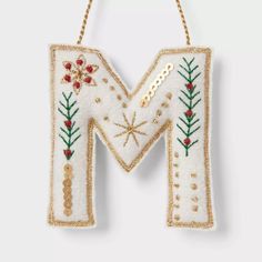 the letter m is decorated with christmas decorations