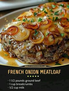 a close up of a plate of food with meat and onions on it, in french onion meatloaf