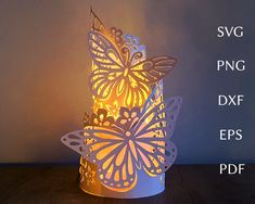 a paper butterfly lamp on a table with the text svg png dxf eps