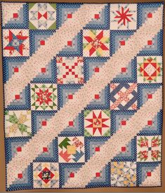 a quilt with many different designs on it