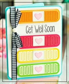 a card with the words get well soon on it and a bow at the top