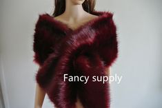 a mannequin wearing a fur shawl with the words fancy supply on it