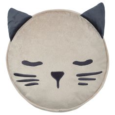 a cat shaped cushion with black ears and eyes