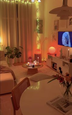 a living room filled with furniture and a flat screen tv