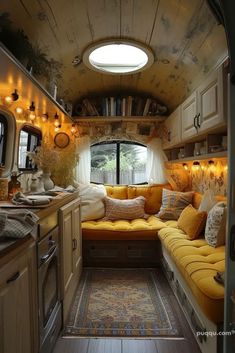 the interior of an rv is decorated with yellow and white furniture, including a couch