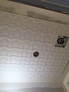 the ceiling is being painted with white paint