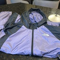 Brand New Jacket With Tags Purple Outdoor Windbreaker With Pockets, Purple Hooded Windbreaker With Pockets, Purple Streetwear Windbreaker With Pockets, Purple Long Sleeve Windbreaker For Fall, Casual Purple Outerwear For Outdoor Activities, Purple Outdoor Outerwear For Spring, Fall Hiking Purple Outerwear, Casual Purple Windbreaker With Pockets, Casual Purple Outerwear For Hiking