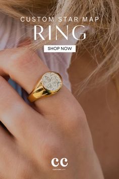 a woman's hand with a ring on it and the text custom star map ring shop now