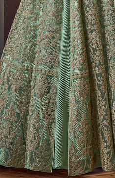 COLOR : Mint Green FABRIC : Top (Jacket) - Net, Bottom (Lehenga) - Santoon, Inner - Crushed Satin, Dupatta - ChiffonWORK : Heavy Zari Work, 3D Tonal Glitter Cord Work, Stones, Sequins, Lace Border OCCASION : Wedding, Reception, Engagement READY-TO-WEAR : NoSTITCHING : Available as semi-stitched fabric, can be stitched using standard size option (+$30). Note: There might be a slight color variation due to lighting and flash used during photoshoot. The bright shade seen is the best closer view of Wedding Anarkali, Indian Anarkali Dresses, Mint Green Fabric, Indian Anarkali, Anarkali Dresses, Holiday Promotions, Anarkali Gown, Half Skirt, Zari Work