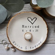 a wedding ring sits on top of a plate