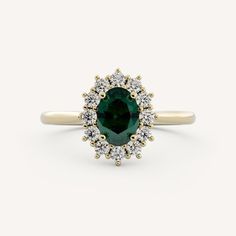 an oval cut green and white diamond ring