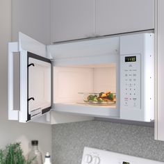 an open microwave oven with food in it