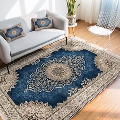 a living room with a couch, chair and rug