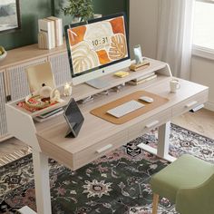 a computer desk with a laptop on top of it