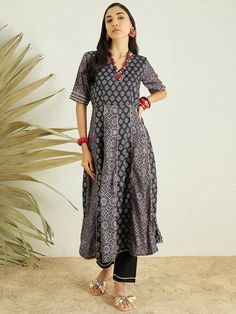 Discover the perfect blend of elegance and comfort with our Black Floral Printed Anarkali Gotta Patti Kurta with Trousers. Adorned with a beautiful floral print and exquisite gotta patti detailing, this Anarkali kurta boasts a v-neck and short regular sleeves for a classic look. The cotton blend machine weave fabric en Black Straight Kurta Anarkali Set With Printed Motifs, Black Semi-stitched Anarkali Set With Gota Work, Black Anarkali Dupatta With Block Print, Black Semi-stitched Anarkali Set With Floral Embroidery, Semi-stitched Black Embroidered Anarkali Set, Western Kurtis, Kaftan Kurta, Printed Anarkali, Gotta Patti