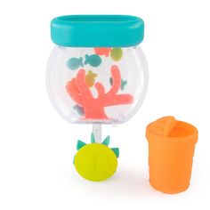 a plastic cup and toy fish in a bowl