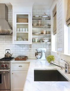 the kitchen is clean and ready to be used for cooking or baking, but it's not too crowded