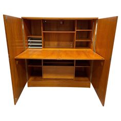 a wooden desk with shelves and drawers