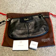 Beautiful, Brand New Coach Ashley Leather Wristlet In Black, W Tags + Dustbag Coach Black Clutch With Zipper Pouch, Chic Coach Bag With Zipper Pouch, Coach Bags With Zipper Pouch For Formal Occasions, Coach Clutch With Removable Pouch, Coach Clutch Pouch For Everyday Use, Coach Black Travel Clutch, Coach Black Clutch For Travel, Black Leather Coach Clutch, Chic Black Coach Clutch