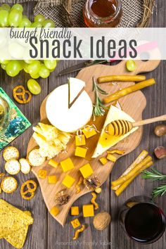 cheese and crackers are arranged on a wooden board with the words budget friendly snack ideas