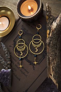 * Stunning statement Moon and Stars earrings which will give your outfit a mystical touch.  * These beautiful dangling earrings have a witchy, bohemian feel to them. * Stainless steel! * The total length of the earrings is approximately 10 cm (aprox 4 inches), hook included.  * They come in a pretty little pouch 🖤 *Matching necklace available: https://www.etsy.com/listing/1736069481/celestial-necklace-with-moon-and-star Celestial Whimsigoth, Celestial Goth, Witchy Boho, Stars Earrings, Celestial Earrings, Moon And Star Earrings, Celestial Necklace, Witchy Jewelry, Celestial Jewelry