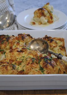 a casserole dish with cheese and spinach